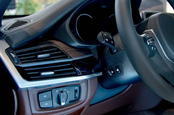 istock Detail of the headlight button in a car 895794108