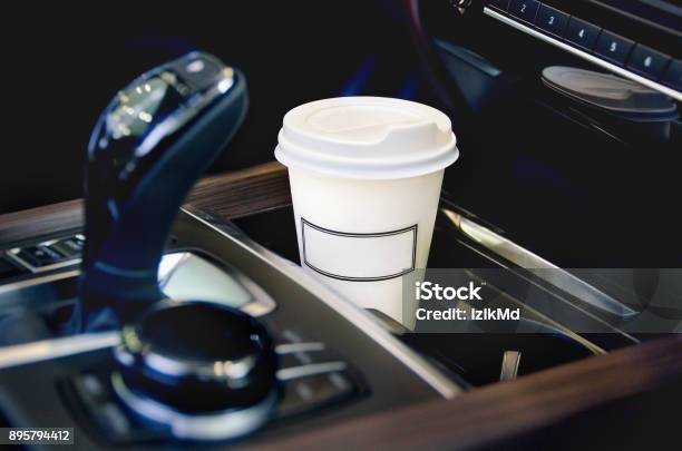 Coffee In The Car Salon A Single Paper Coffee Cup Inside The Car Cup Holder Stock Photo - Download Image Now