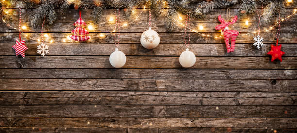 istock Christmas background with wooden decorations and spot lights. 895798842