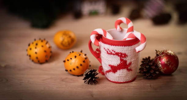 istock Christmas Cup and oranges on wooden background blurred 895802508