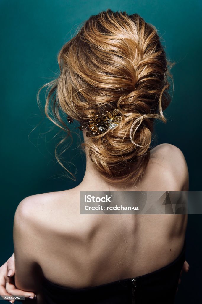 Model blonde Woman with perfect hairstyle and creative hair-dress, back view Bride Stock Photo