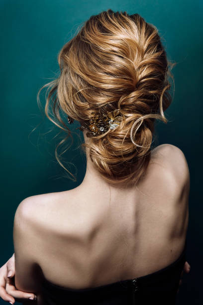 Model blonde Woman with perfect hairstyle and creative hair-dress, back view Model blonde Woman with perfect hairstyle and creative hair-dress, back view bridal hair stock pictures, royalty-free photos & images