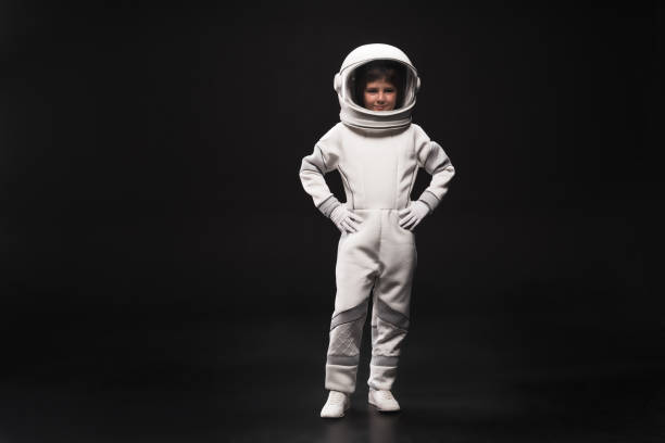 istock Cute little cosmonaut is expressing confidence 895813994