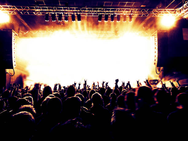 istock Concert stage attended by a large crowd 895816332