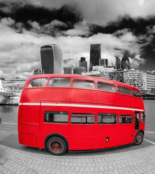 istock Red double decker bus with modern skyscrapers in London, England, UK 895818994