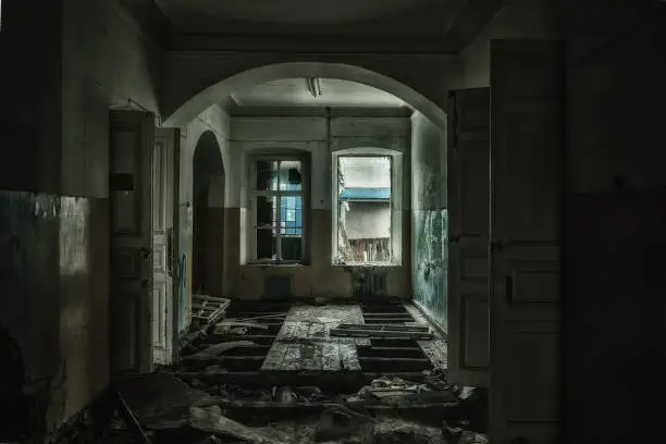 Sinister and creepy interior of abandoned and rotten hospital.