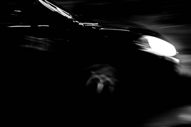 istock Black car in the night 895821614