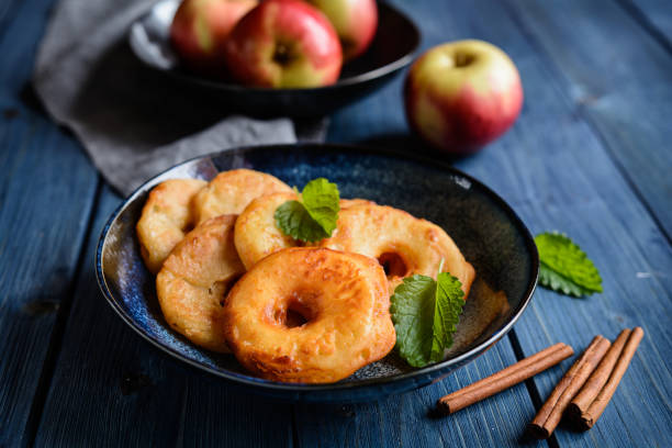 Fried apple rings in a batter Delicious fried apple rings in a batter fritter photos stock pictures, royalty-free photos & images