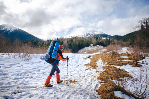 istock Man hiking in beautiful winter mountain 895834284