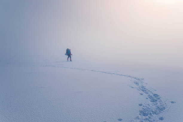 istock Extreme hiking with backpack in winter mountain landscape 895834466