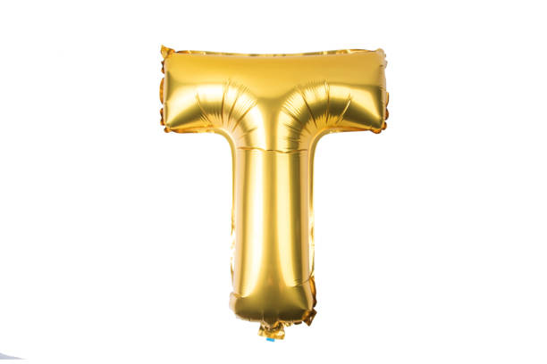 istock English alphabet   from yellow (Golden) balloons on a white background . 895834516