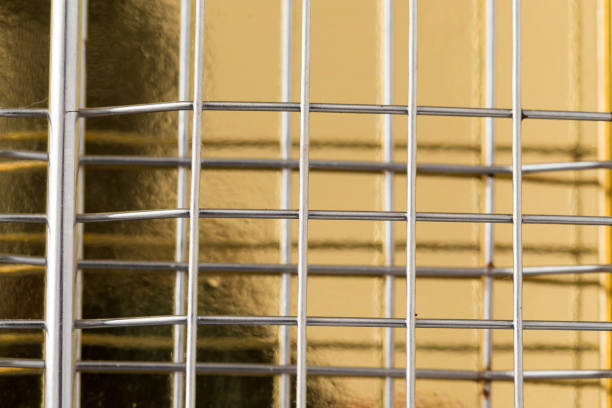 istock metal mesh on a gold background 895841566