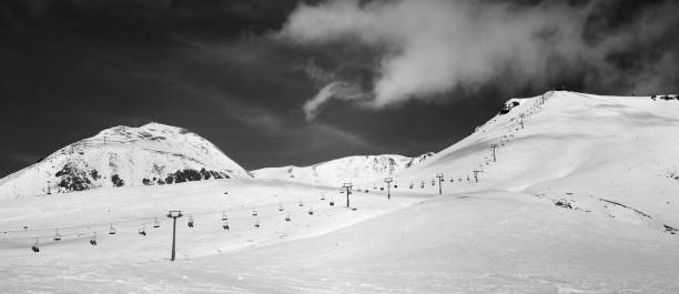 istock Panorama of ski slope at sunny winter day 895853770