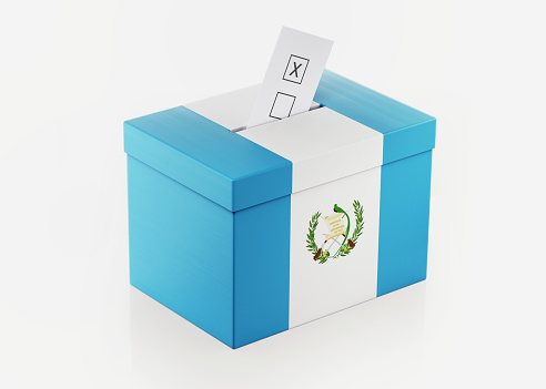 Ballot box textured with Guatemalan flag. Isolated on white background. A vote envelope is entering into the ballot box. Horizontal composition with copy space. Great use for referendum and presidential elections related concepts. Clipping path is included.