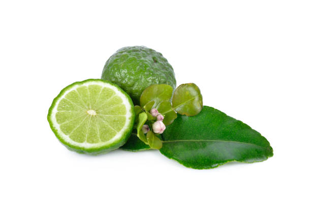 istock whole and half cut fresh bergamot with leaf on white background 895859514