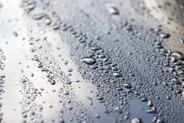 istock drops of water on a dark car 895895218