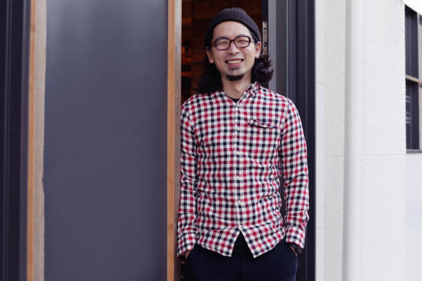 istock Cafe owner standing at the entrance 895903090