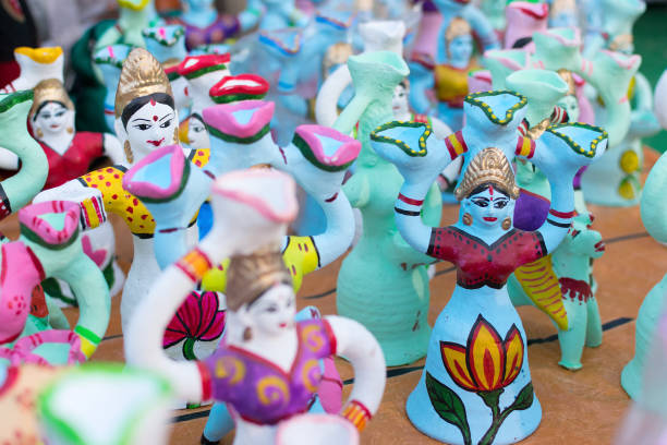 istock Colorful dolls made of clay, handicrafts on display. 895907998