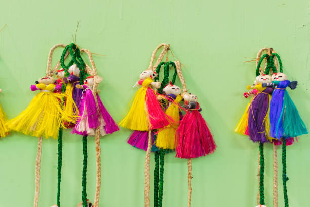 istock Wall hangings - jute made dolls, handicrafts on display 895908088