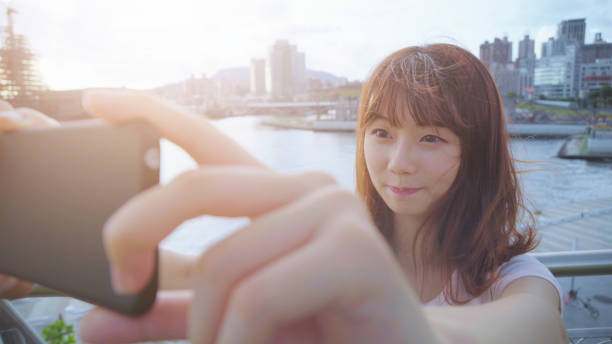istock young woman smile take selfie 895911178