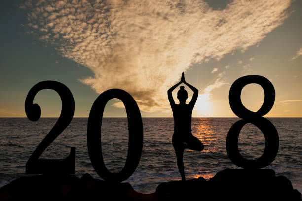 istock New year 2018 yoga concept woman pose 895913342