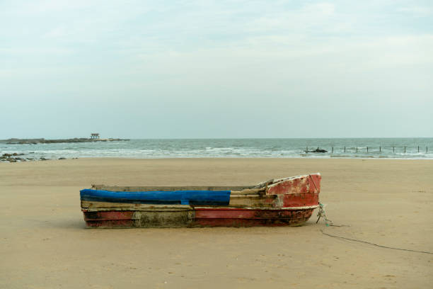 istock old wooden boat abandoned on beach sands 895921234