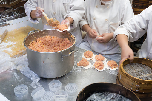 Chefs making Shanghai dumplings at a restaurant in China
