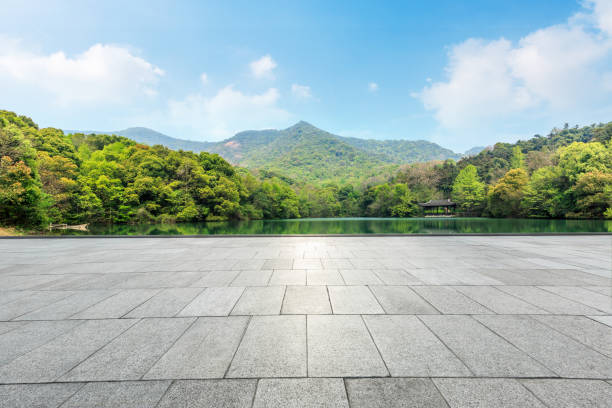 istock empty square and green mountain nature landscape in city park 895966546