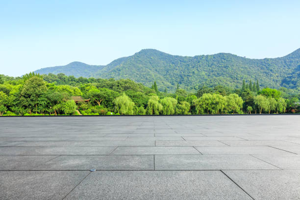 istock empty square and green mountain nature landscape in city park 895966662