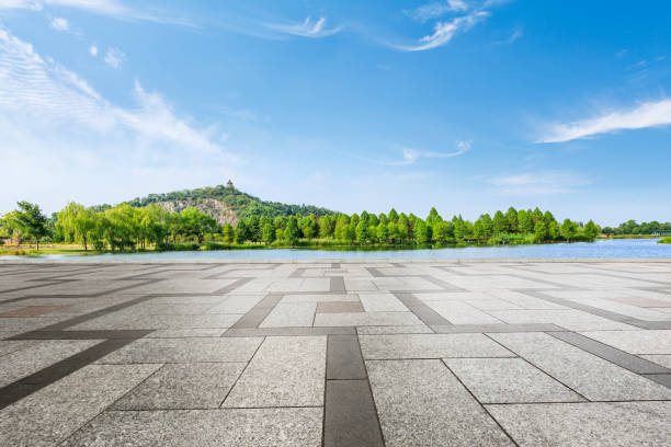 istock empty square and green mountain nature landscape in city park 895966820