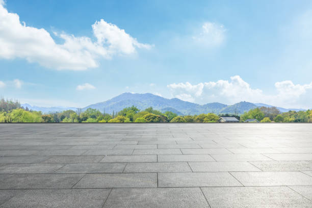 istock empty square and green mountain nature landscape in city park 895966832