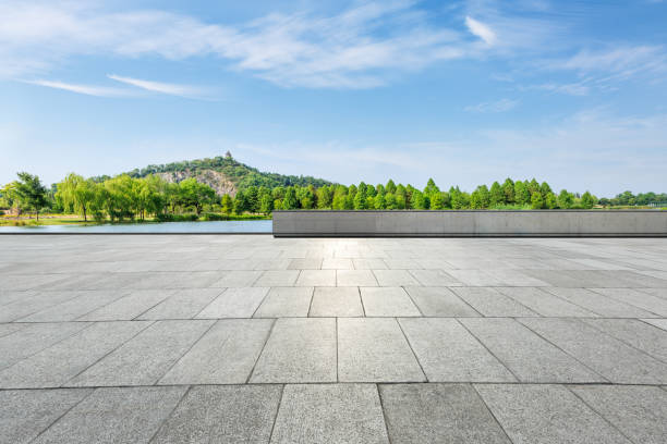 istock empty square and green mountain nature landscape in city park 895966834
