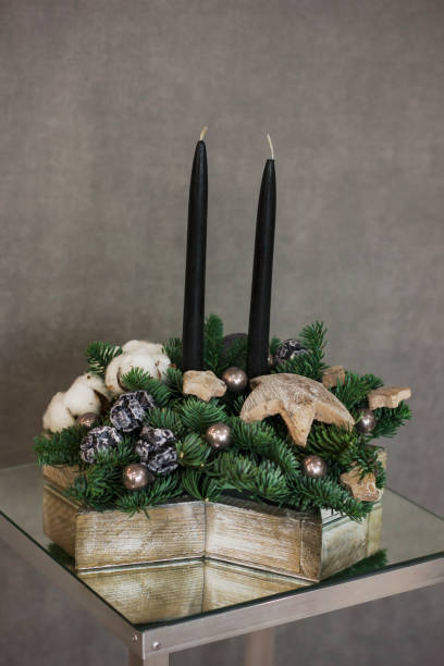istock Interior Christmas wreath in star shape with black candles on a gray background 895968966
