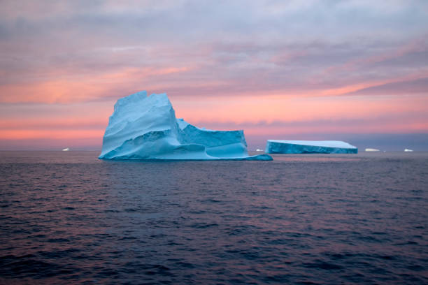 istock Pink sunset over icebergs in the Southern ocean 895968998