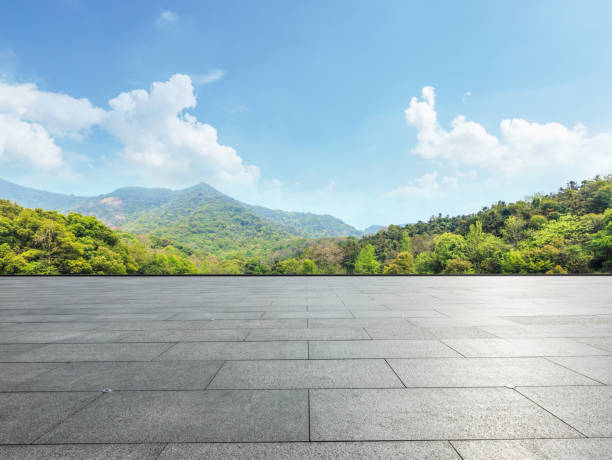 istock empty square and green mountain nature landscape in city park 895969682