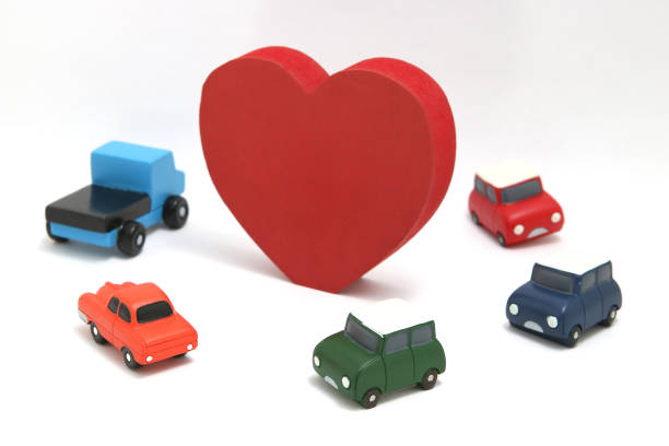 istock Some red hearts and cars on white background. 895972246