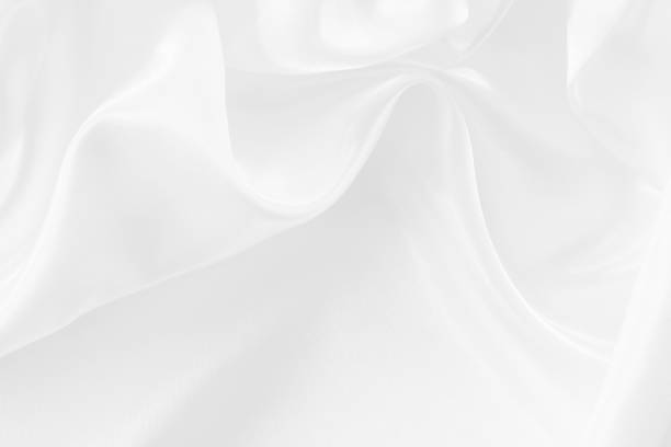istock White fabric texture for background and design, beautiful pattern of silk or linen. 895974842