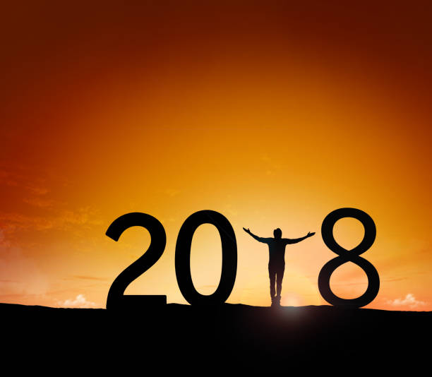 istock Silhouette young man Happy for 2018 new year 895994358