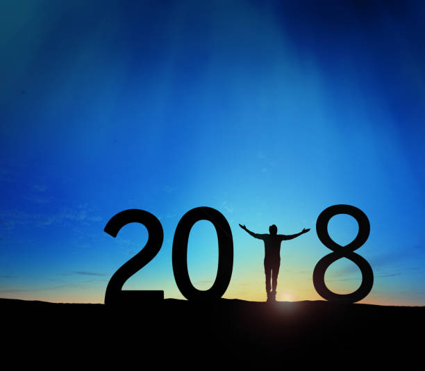 istock Silhouette young man Happy for 2018 new year 895994400