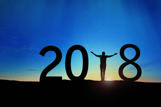 istock Silhouette young man Happy for 2018 new year 895994438