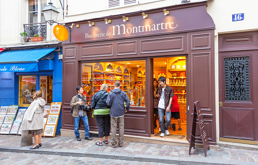 PARIS, FRANCE â JUNE 6, 2012: Unidentified tourists at a traditional biscuit shop in Montmarte in Paris.