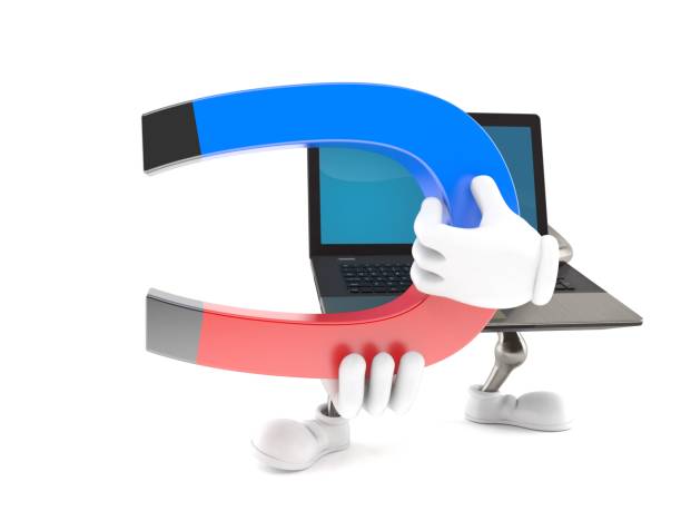 istock Laptop character holding horseshoe magnet 895997508