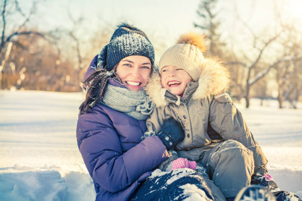 istock Mother and daughter playing at winter day 896000068