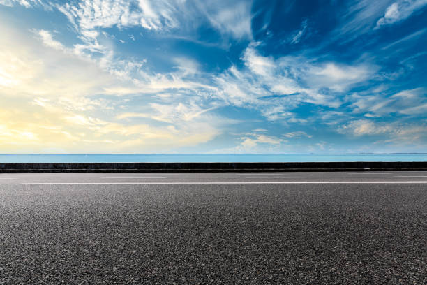istock empty asphalt road and blue sea nature landscape at sunset 896000600