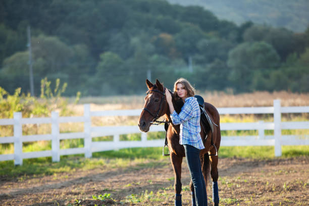 istock Beautiful girl with horse 896003696