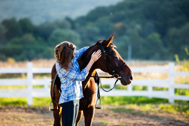istock Beautiful girl with horse 896003730
