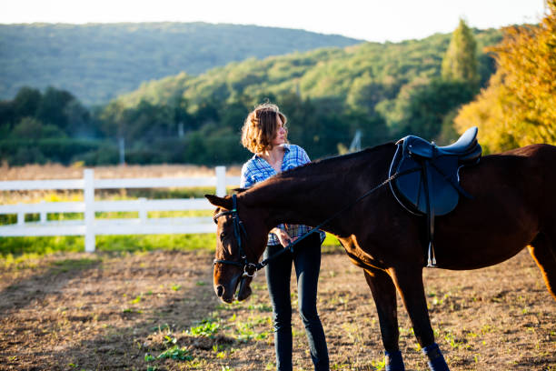 istock Beautiful girl with horse 896003830