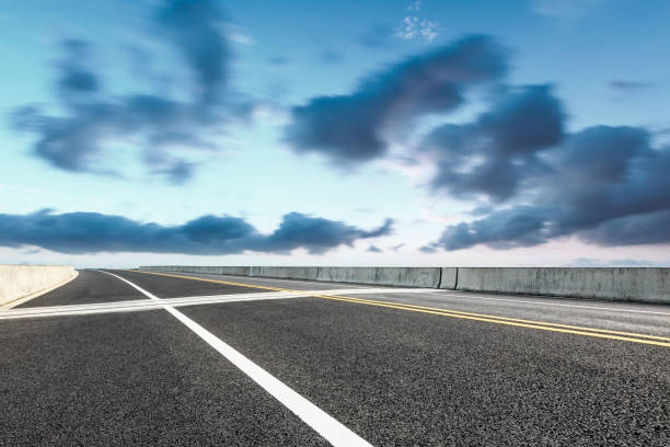 istock asphalt highway and sky clouds landscape at sunset 896008266