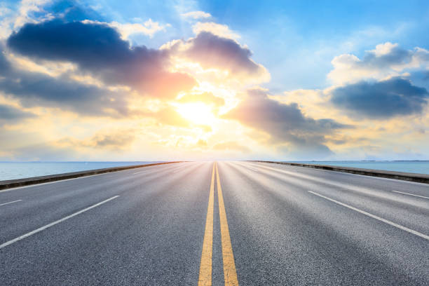 istock empty asphalt road and blue sea nature landscape at sunset 896008512