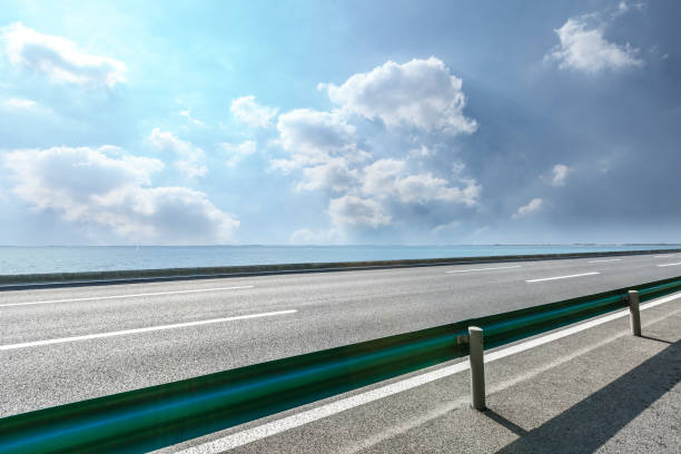 istock asphalt highway and beautiful sea under the blue sky 896008710